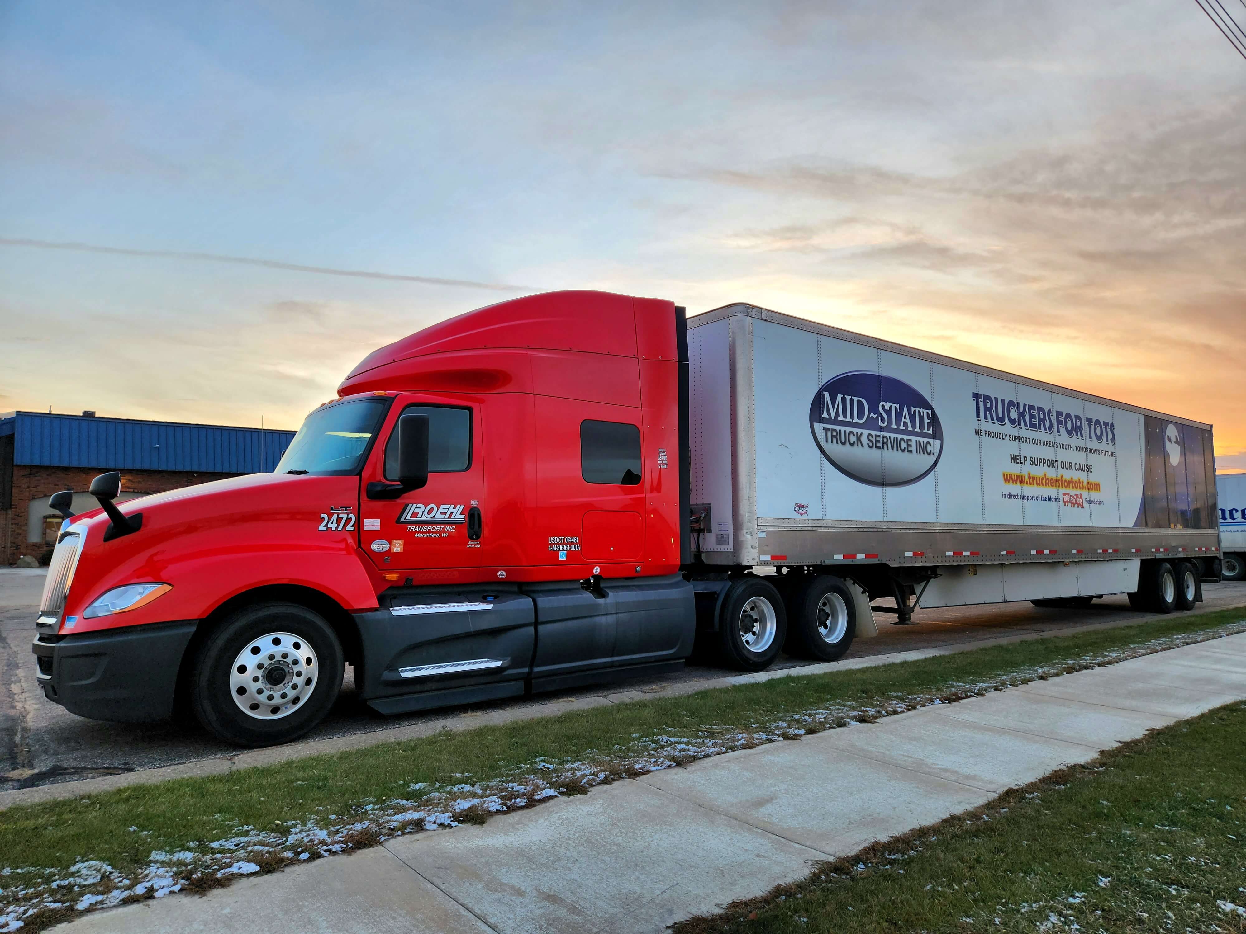 Truckers for Tots trailer parked at sunrise